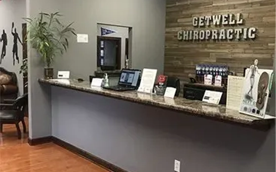 Modern reception desk with clear signage and organized displays