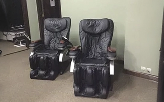 Dual zero‑gravity massage chairs providing seated therapy options for quick relaxation and muscle relief.
